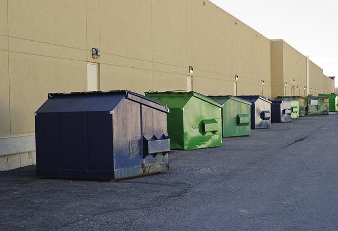 a fleet of red and blue construction dumpsters available for use in Mentor OH